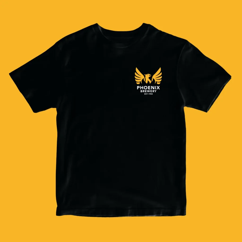 Black Phoenix Brewery t-shirt front with small gold phoenix chest logo on a yellow background