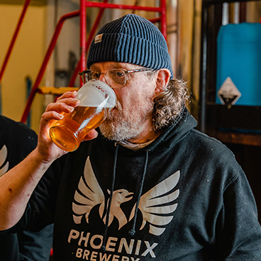 Phoenix Brewery team member Andrew enjoying a pint of Phoenix Brewery beer