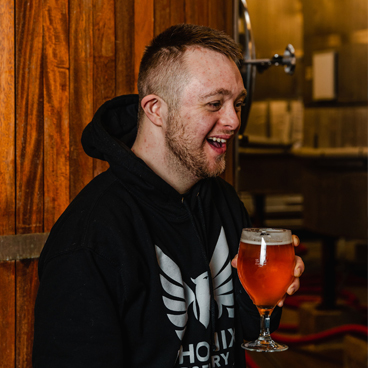 Phoenix Brewery team member Leo enjoying a pint of Phoenix Brewery beer