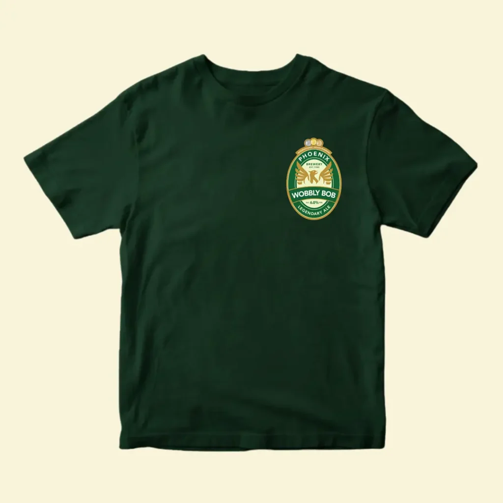 Dark green t-shirt front with small Wobbly Bob beer label chest print on a cream background